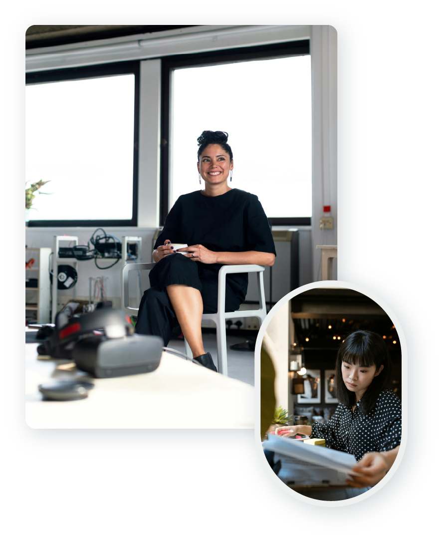 A happy woman smiling with her coffee and a small business owner looking over financial reports.