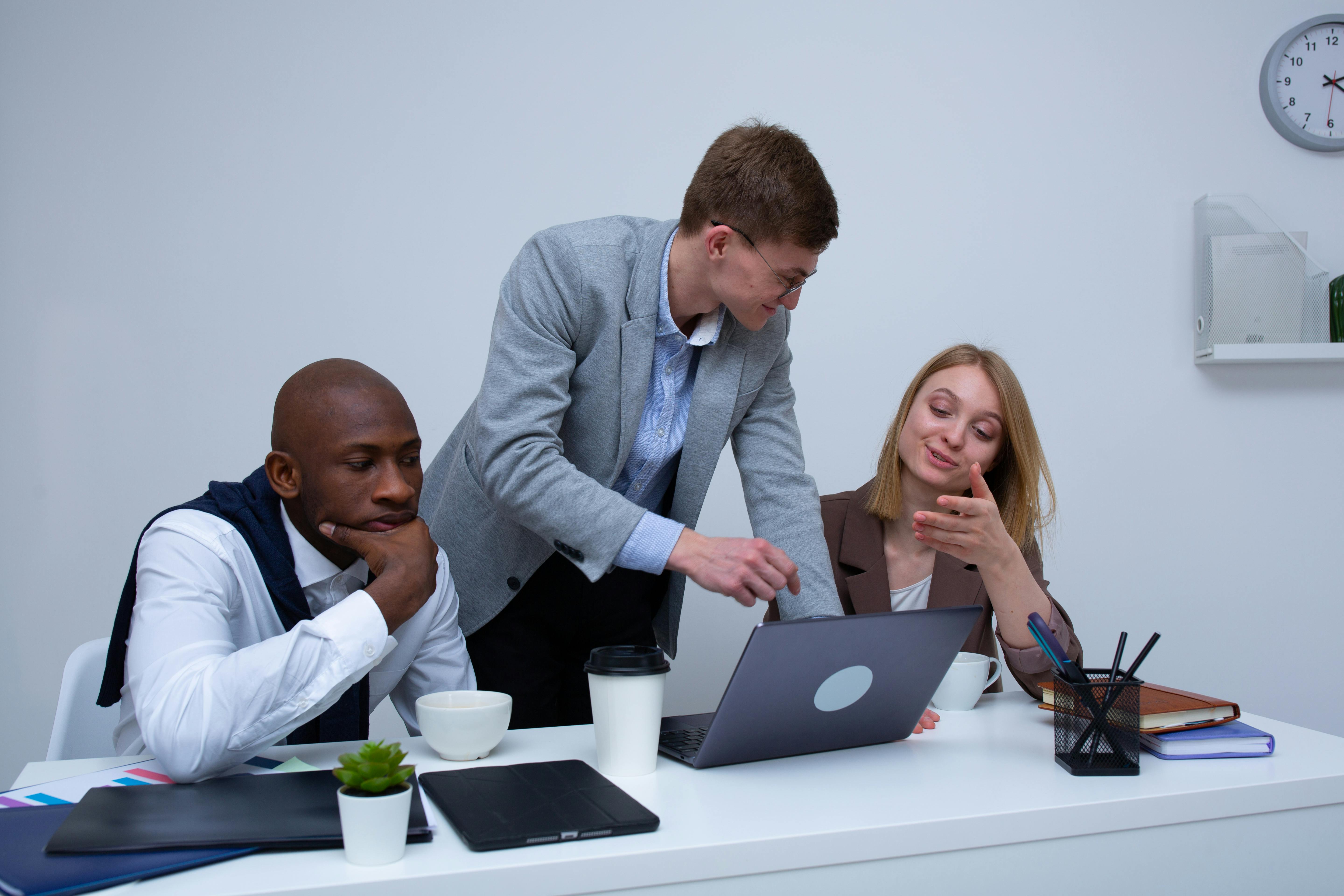 Team collaboration in office, reviewing business structure choices such as S Corps and Partnerships